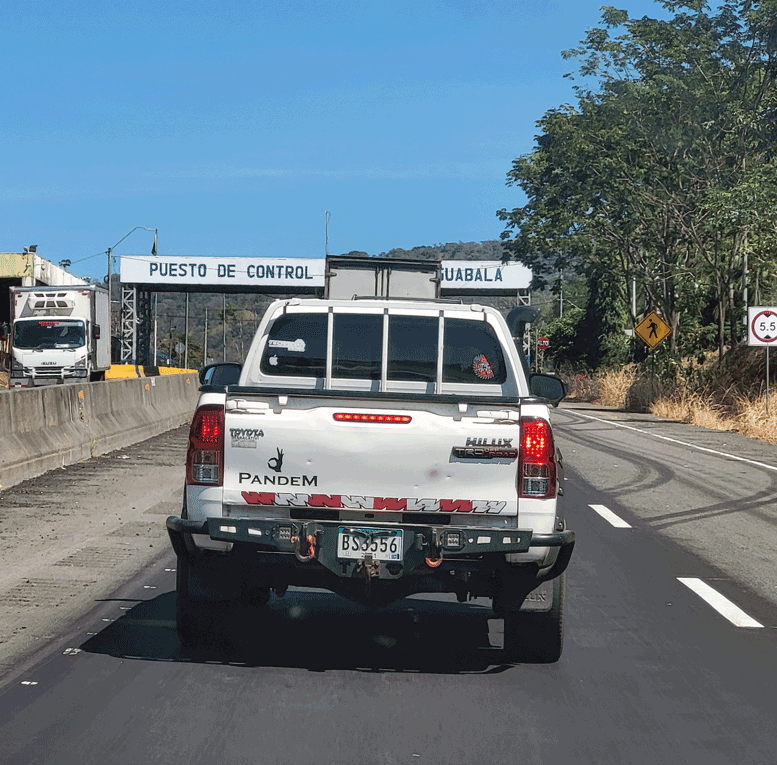 Truck in front of Puesto de Control (i.e., a highway checkpoint on Route 1) in Guabala, Panama.
