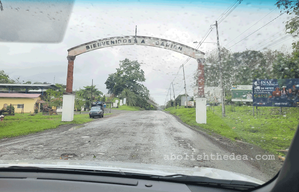 Road sign over route 1 in Agua Frita, Panama, reading 'Bienvenidos a Darien'