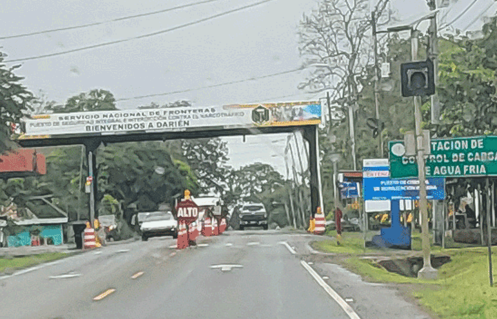 Check point on Route 1 in Agua Fria, Panama, the first town in the Darien Province.  Signs in Spanish say 'Alto, Servicio Nacional de Fronter
