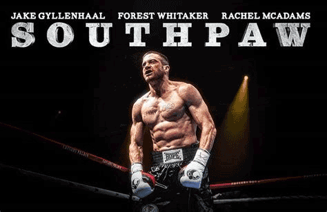 Movie poster for The Southpaw starring Jake Gyllenhaal as Billy Hope.  A low-angle shot reveals Billy standing alone in a boxing ring against a dark background faintly lit by a single spotlight.