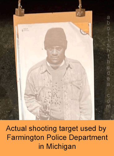Shooting target filled with bullet  holes, depicting an Afro-American holding a gun. Caption: Actual shooting target used by Farmington Police Department in Michigan.